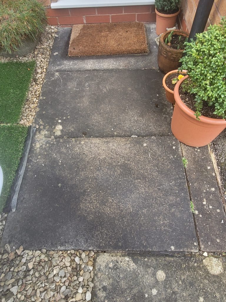 Expert garden makeover in Midsomer Norton - featuring a beautiful seating area with high-quality artificial grass, stunning autumn bronze paving, and a new fence for added privacy and aesthetic appeal