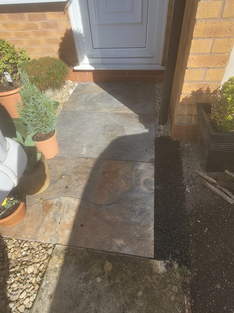 Expert garden makeover in Midsomer Norton - featuring a beautiful seating area with high-quality artificial grass, stunning autumn bronze paving, and a new fence for added privacy and aesthetic appeal