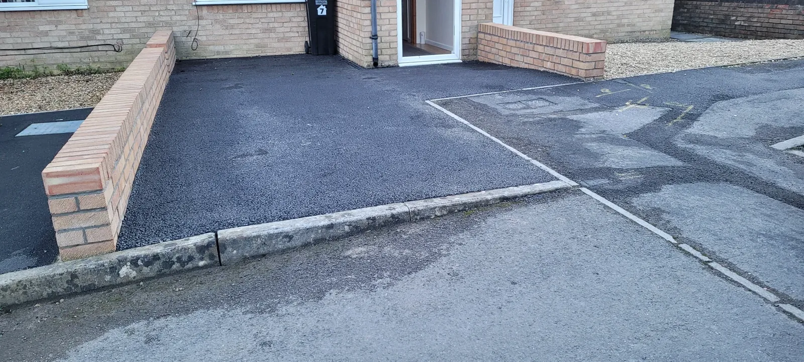 Tidy and low maintenance Westfield driveway with drainage channels and soakaway.